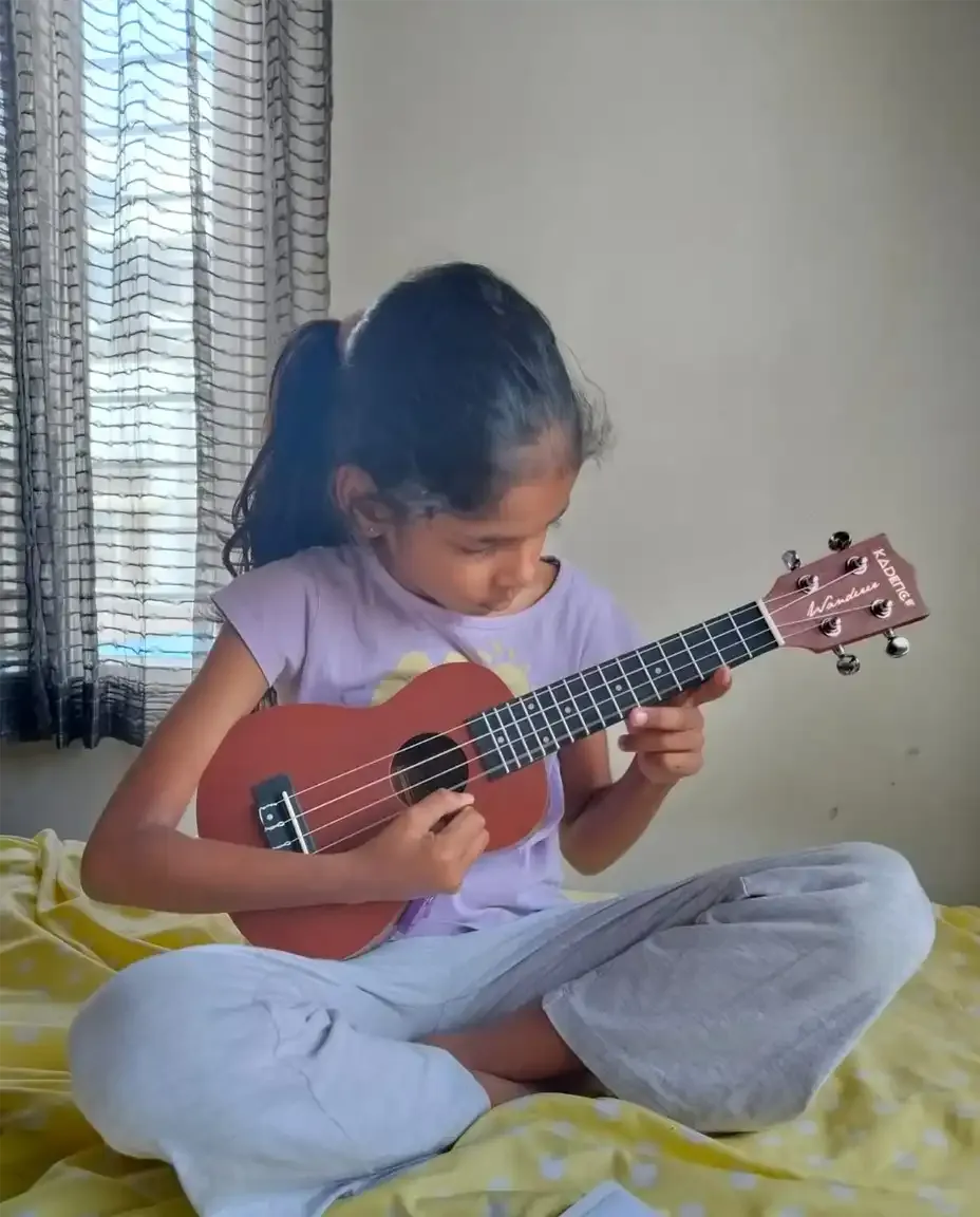 Ukulele lesson at a student's home in Bengaluru